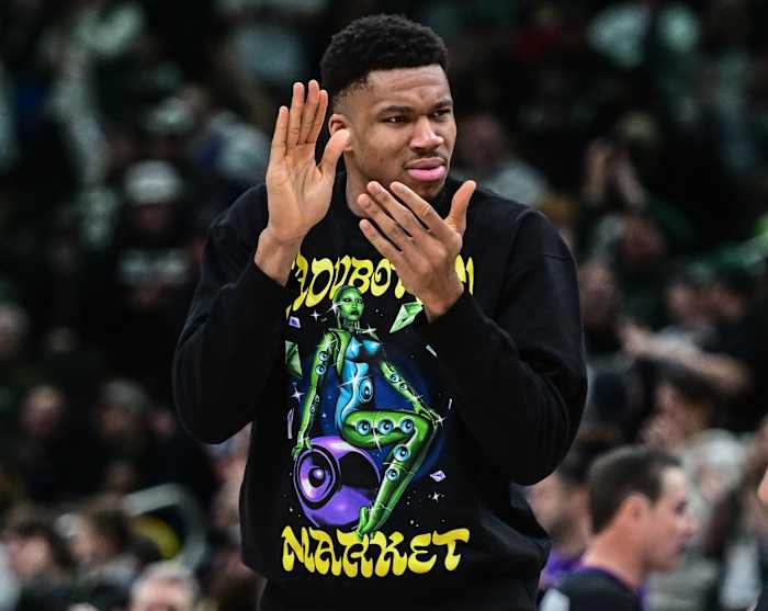 Milwaukee Bucks forward Giannis Antetokounmpo (34) cheers from the bench during game against the Indiana Pacers